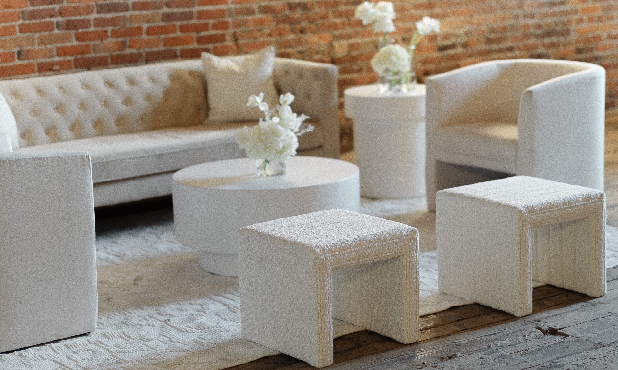 tasteful off-white furniture with white flowers on the table